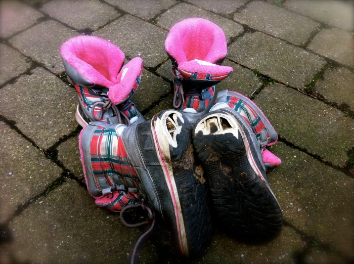 Two pairs of kids' boots after 90 days in the UK